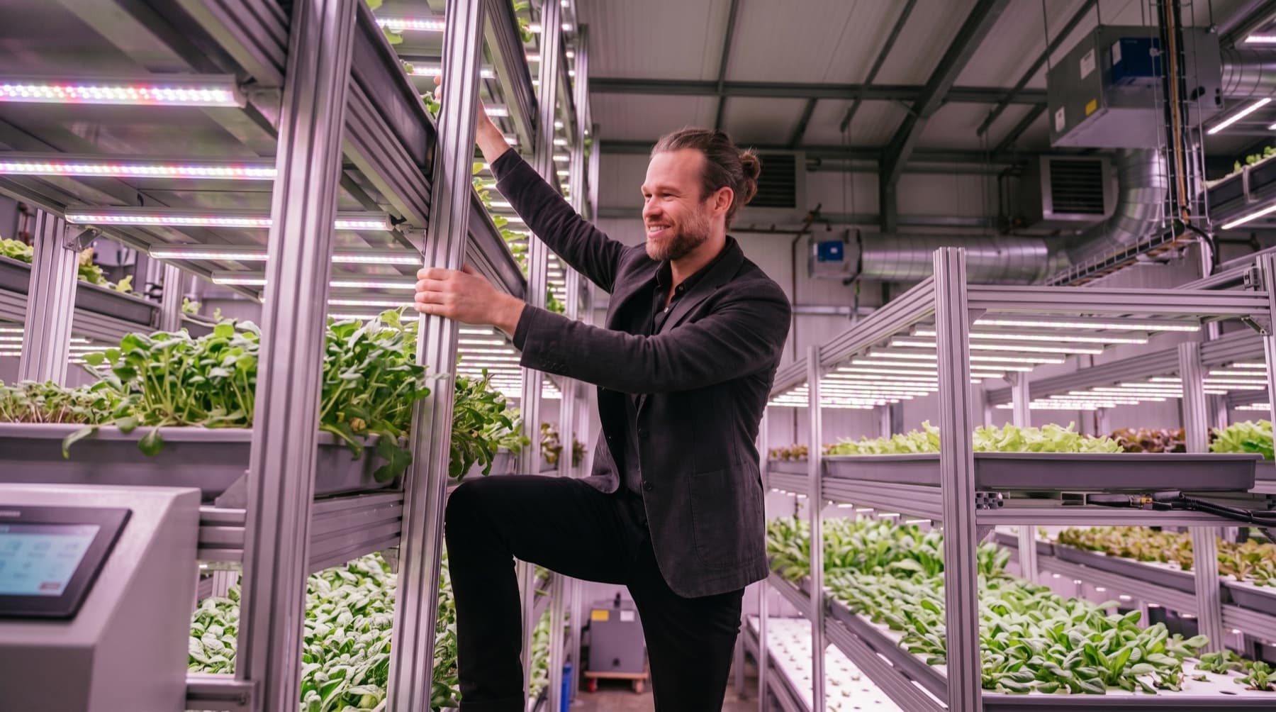 Esia Nathaniel inside the Urban Oasis vertical farm