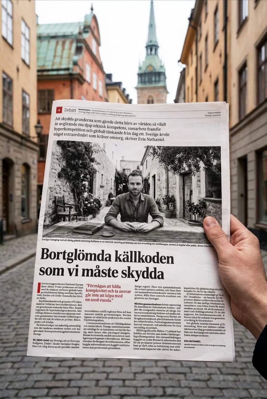 The printed piece in Dagens Industri, held up on a street in Gamla Stan, Stockholm